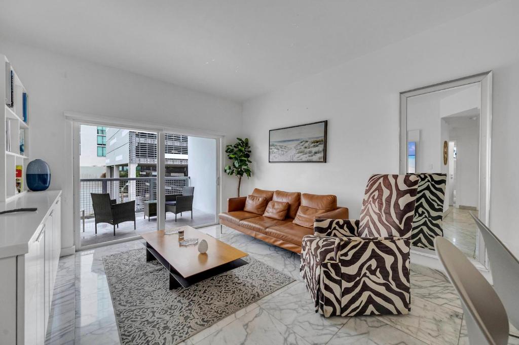 a living room with a couch and a table at Subtle 2 Bed in Edgewater near Downtown With Free Parking in Miami