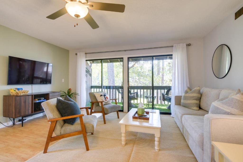 a living room with a couch and a tv at Pinehurst Condo Rental Near Golf with Pool Access! in Pinehurst