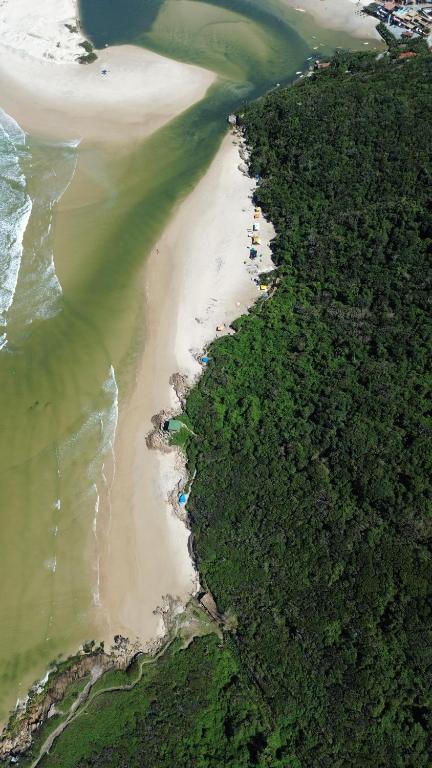 an aerial view of a beach and the ocean at MORADA GARAPEIRA in Guarda do Embaú