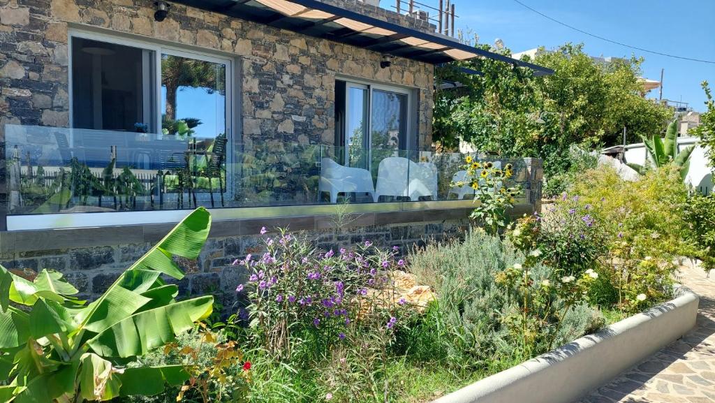 a garden in front of a house with plants at Istron Avra in Kalo Chorio