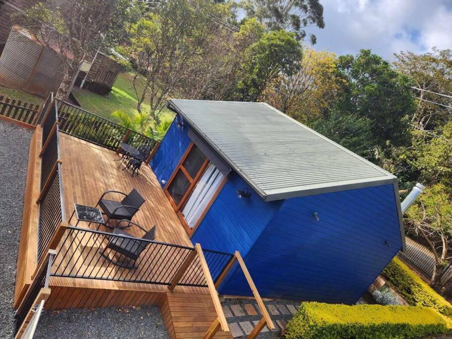 an overhead view of a blue house with a deck at Bluebell Cottage in Beechmont