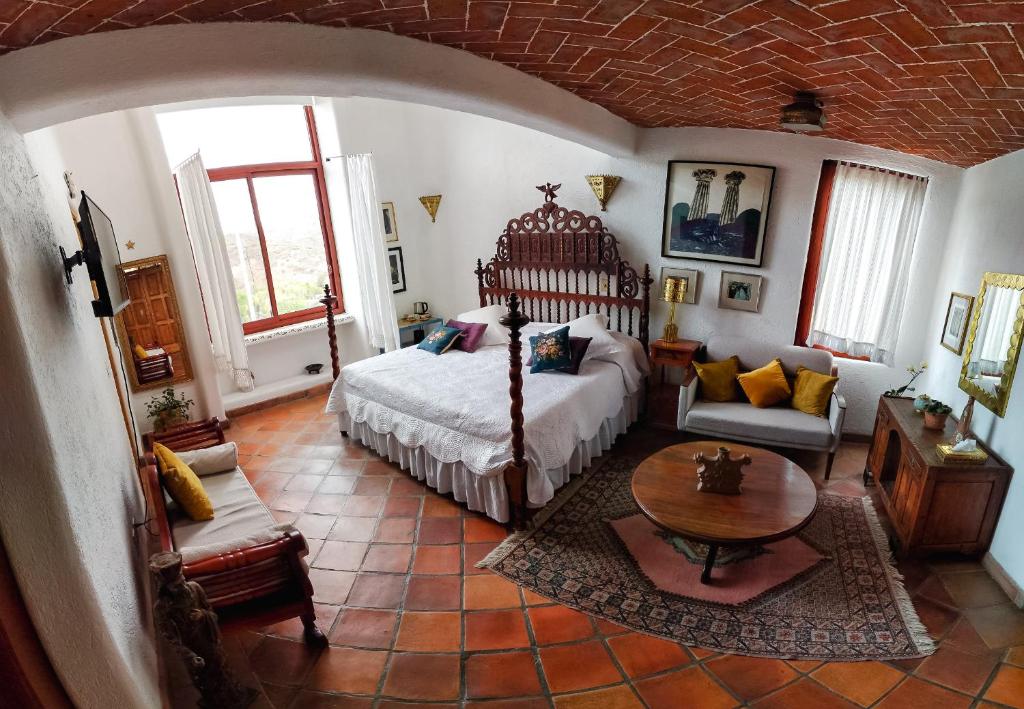 Ένα ή περισσότερα κρεβάτια σε δωμάτιο στο Casa Estela y Virgilio B&B