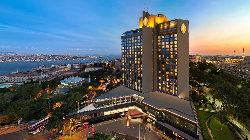 a tall building with a clock tower on top of it at InterContinental Istanbul, an IHG Hotel in Istanbul