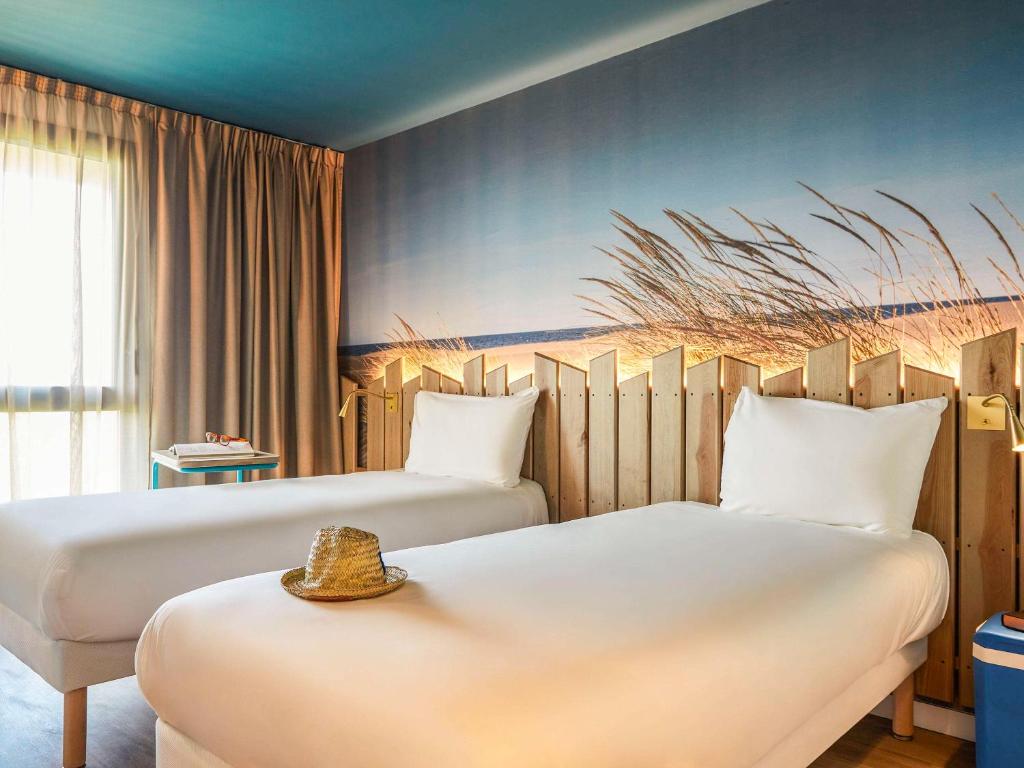 Postel nebo postele na pokoji v ubytování Ibis Styles Montpellier Aéroport Parc Des Expos