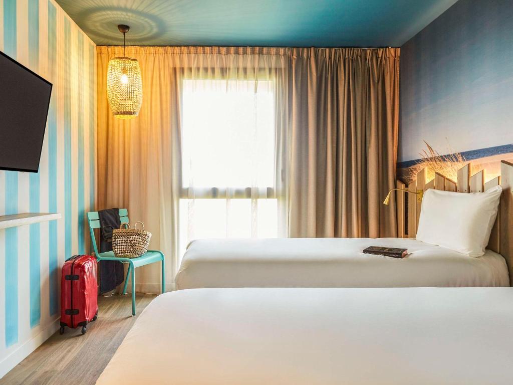 Postel nebo postele na pokoji v ubytování Ibis Styles Montpellier Aéroport Parc Des Expos
