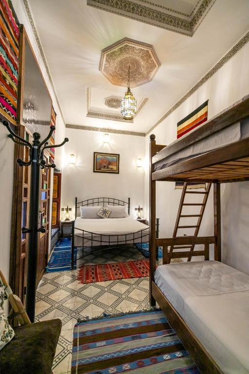 Postel nebo postele na pokoji v ubytování Riad Fes Allouch