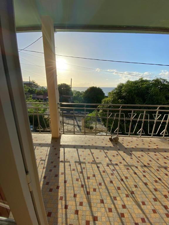 a view from the balcony of a house at Télétravail et Plaisir au soleil avec vue mer! in Bouillante