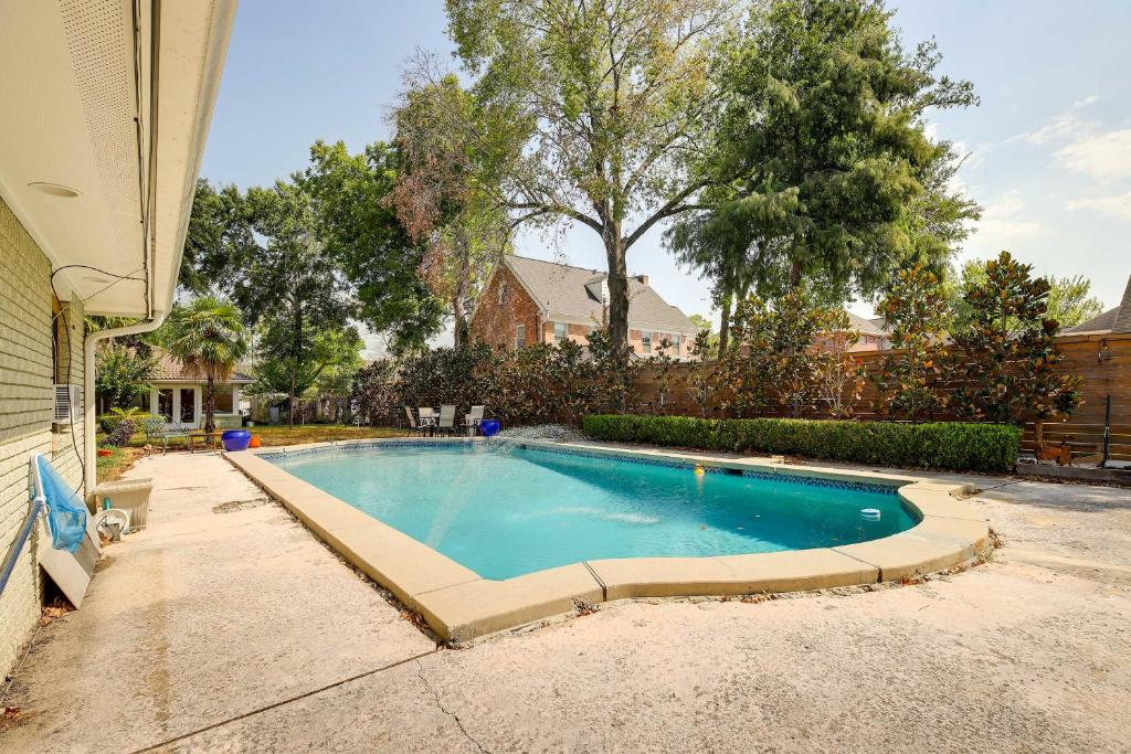 a swimming pool in the backyard of a house at Cozy Houston Studio with Pool Access! in Houston