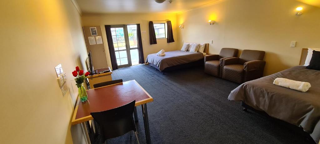 Postel nebo postele na pokoji v ubytování New Castle Motor Lodge