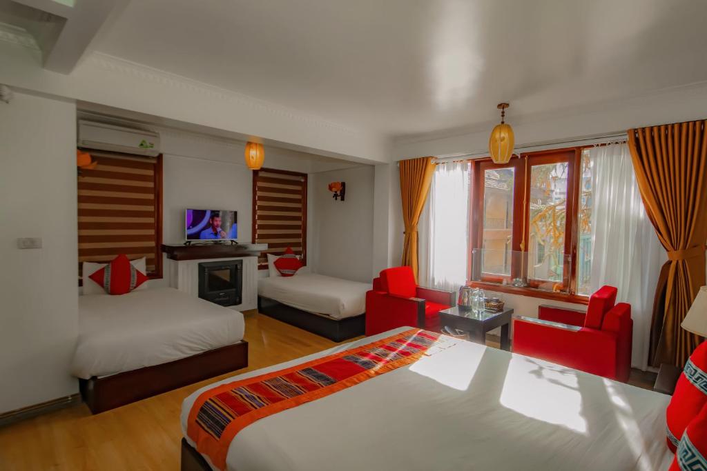 Postel nebo postele na pokoji v ubytování Sapa Elite Hotel