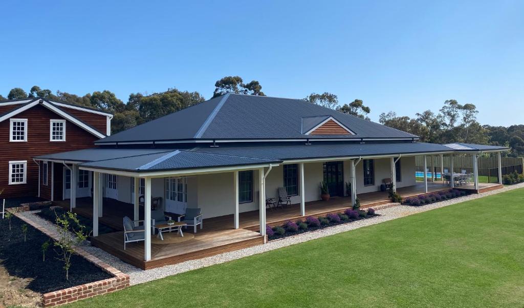 an image of a house with a metal roof at Yallingup Homestead Guest House in Dunsborough