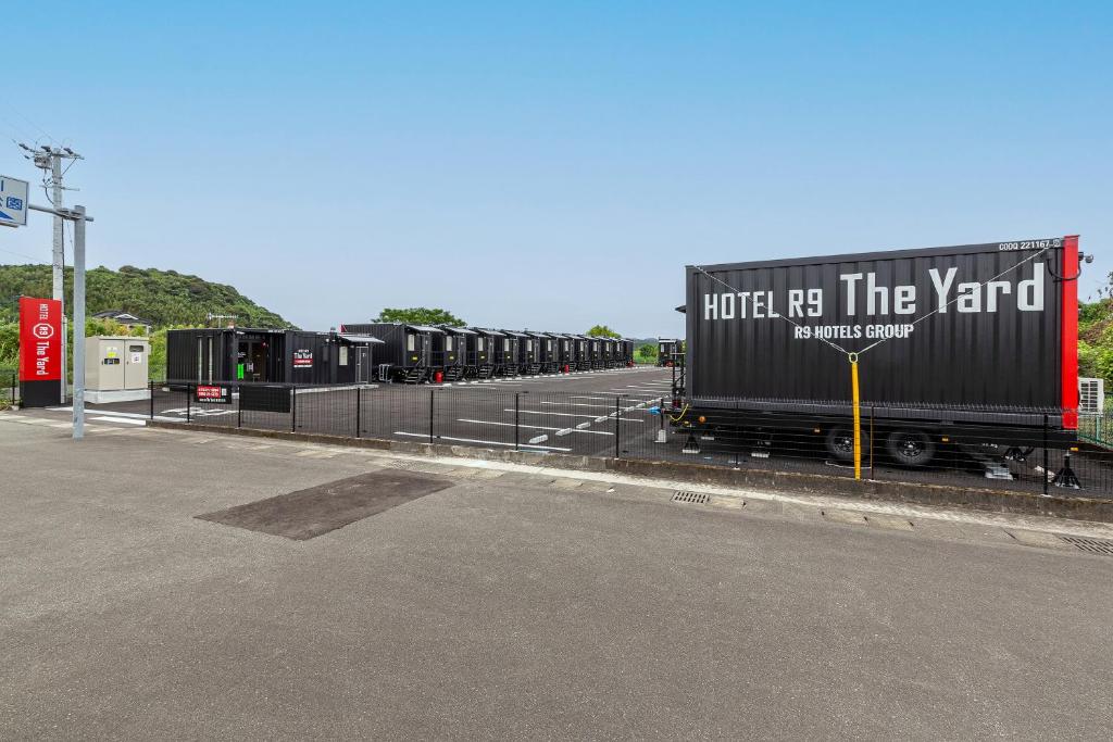 a truck parked on the side of a road at HOTEL R9 The Yard Satsumasendai in Satsumasendai