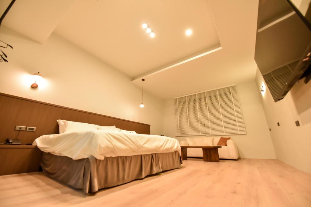 Postel nebo postele na pokoji v ubytování Two Couples Leisure Art Motel
