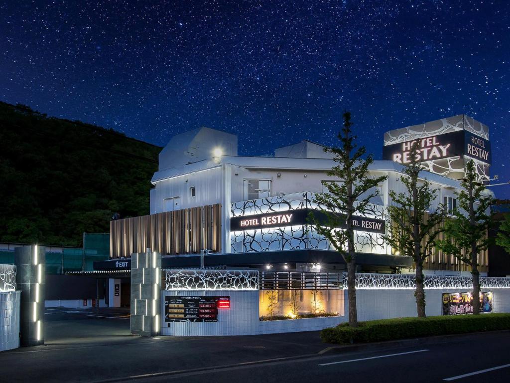 a building at night with a starry sky at Restay Onoji (Adult Only) in Machida