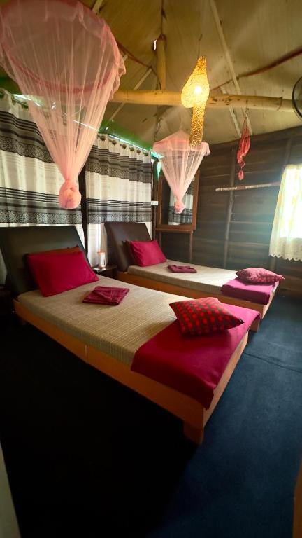 Postel nebo postele na pokoji v ubytování A Lounge Hostel And Cafe