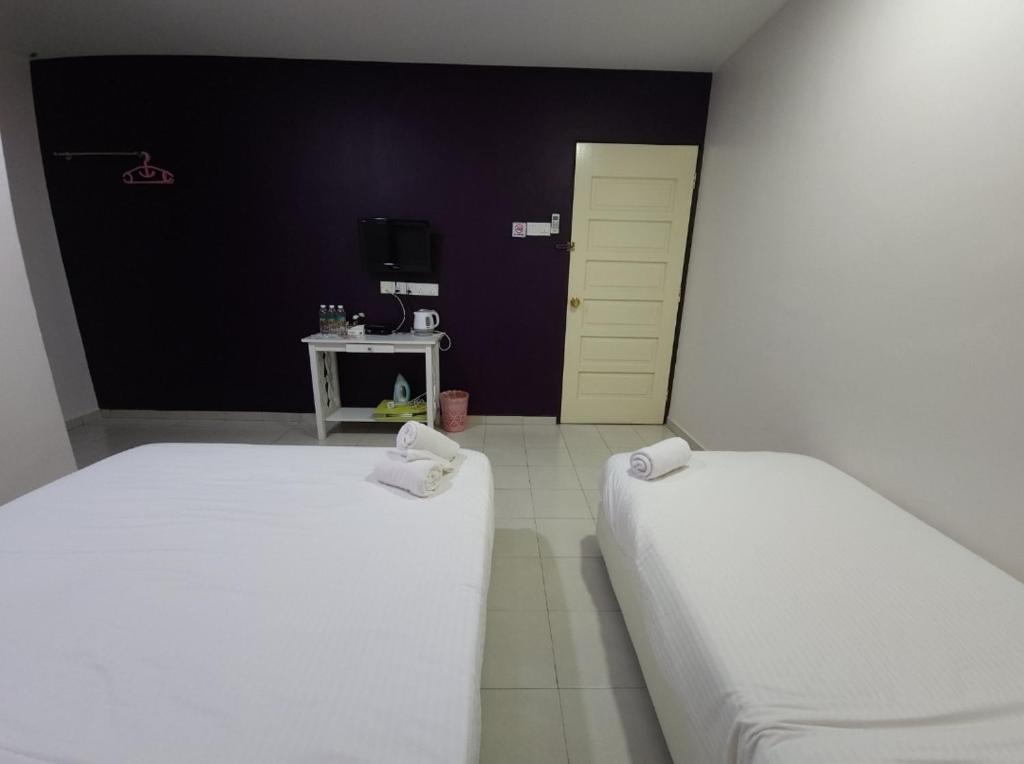 Postel nebo postele na pokoji v ubytování Minshu RoomStay