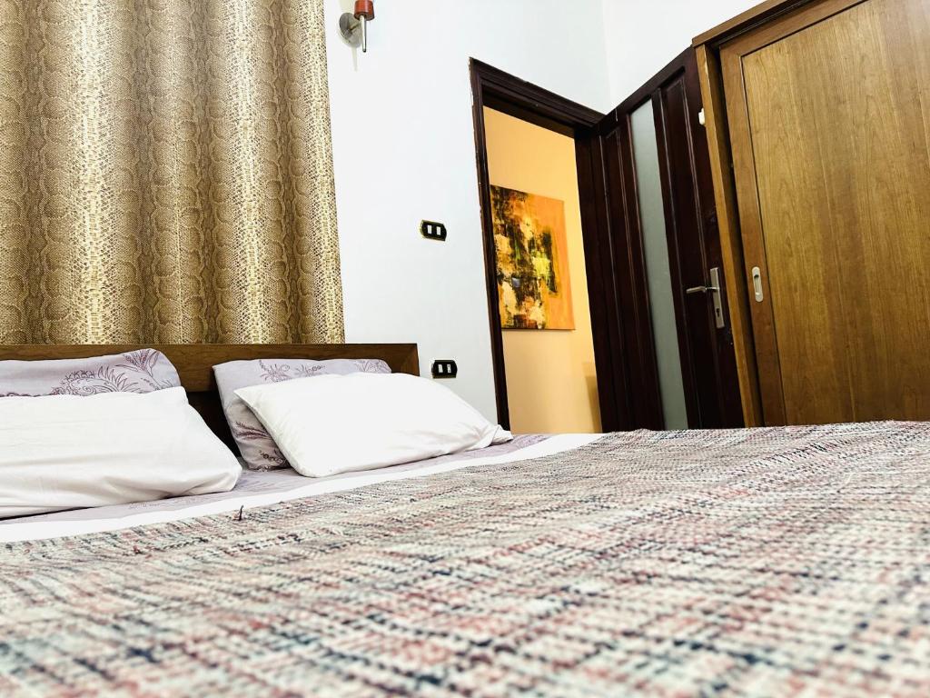 Postel nebo postele na pokoji v ubytování Diamond Arabia Orange