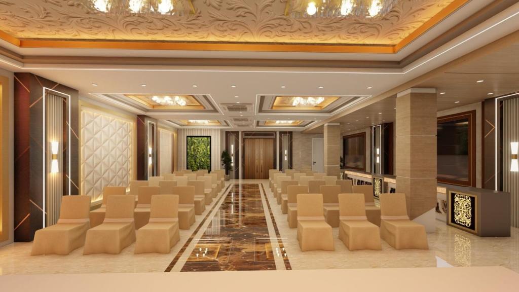 a conference room with rows of chairs in a building at HOTEL AASTHA SHREE DHAM in Lucknow