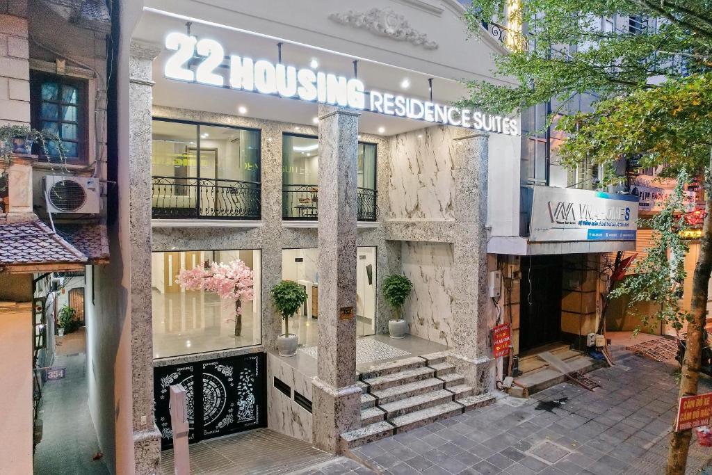 a building with a sign on the front of it at 22housing Residence Suites in Hanoi