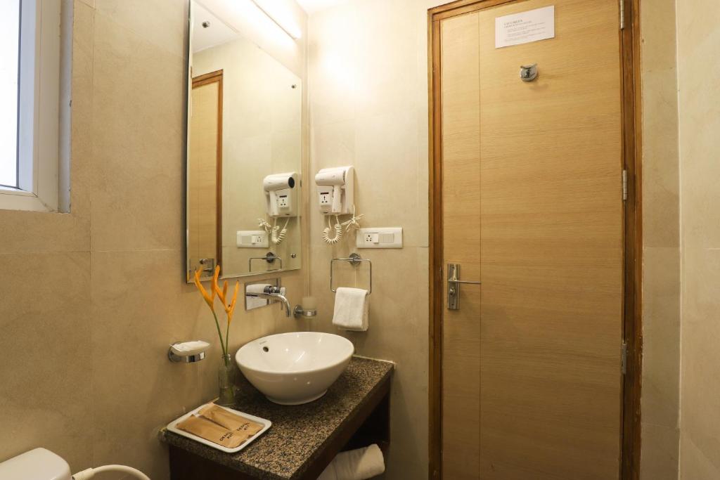 Koupelna v ubytování Veeraas Strand Park Apartment by Alaya Stays