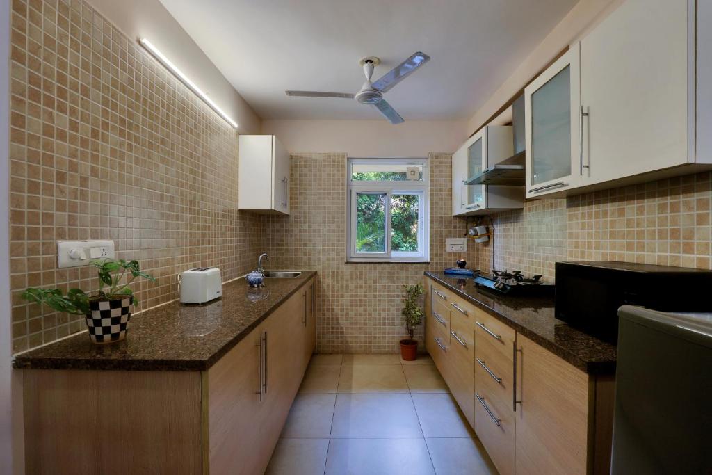 Kuchyň nebo kuchyňský kout v ubytování Veeraas Strand Park Apartment by Alaya Stays