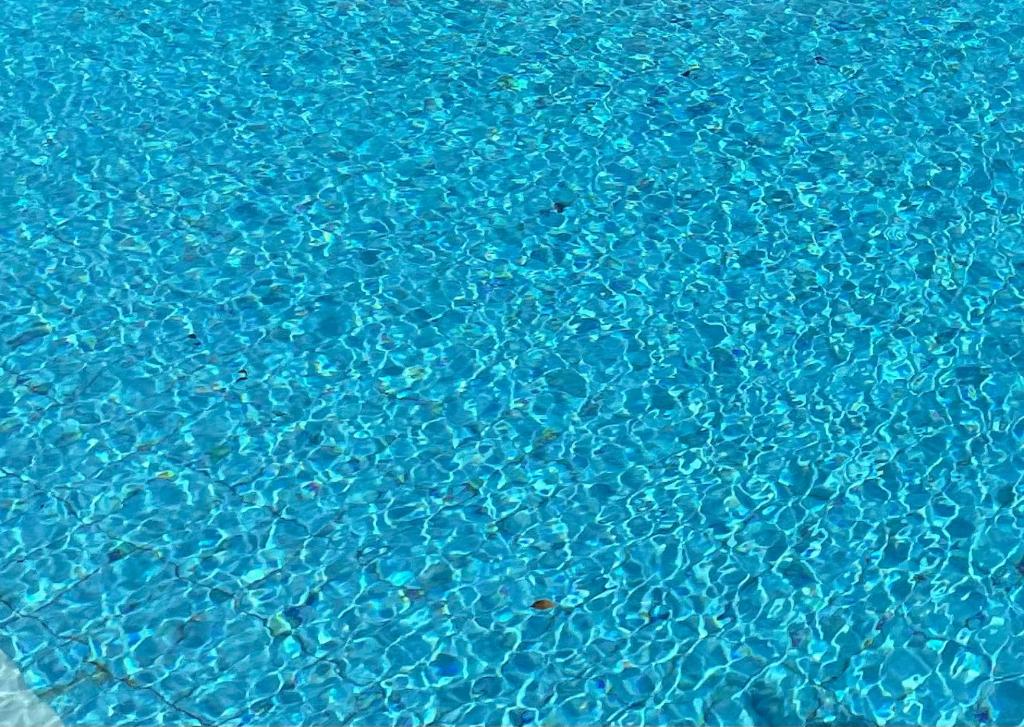 a close up of blue water in a swimming pool at Beautiful Home in Paphos City