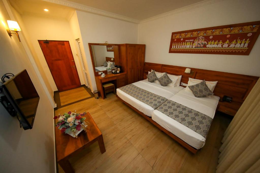 Postel nebo postele na pokoji v ubytování BPR - Asgiriya ,Kandy