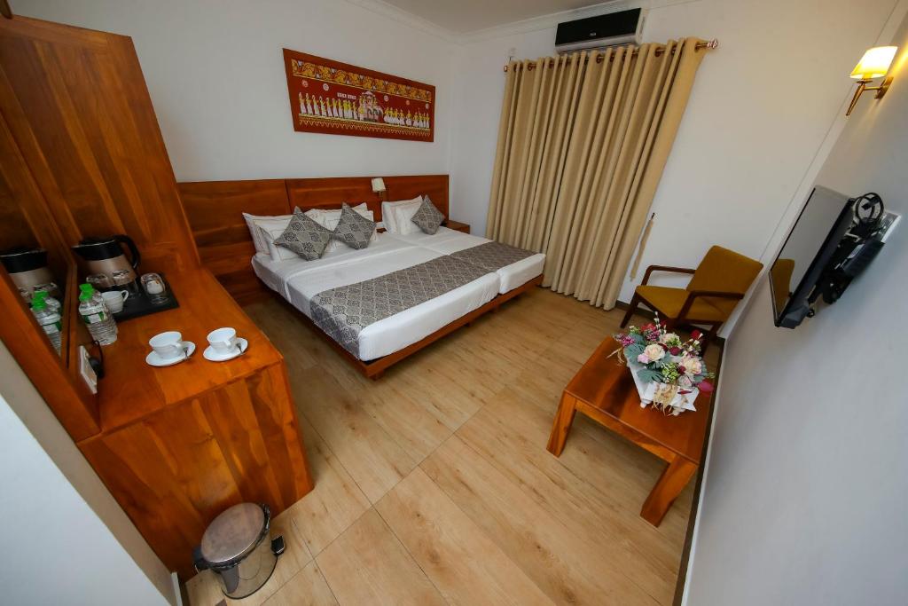 Postel nebo postele na pokoji v ubytování BPR - Asgiriya ,Kandy