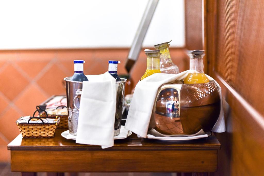 a table with bottles and a bag on it at ALEGRIA Bodega Real in El Puerto de Santa María