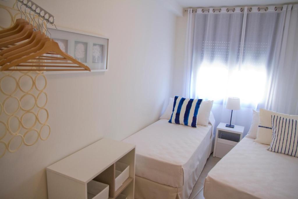 Postel nebo postele na pokoji v ubytování SANTA SUSANNA Chic! Apartments by ALEGRIA