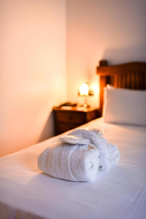 a towel sitting on top of a bed at ALEGRIA Bodega Real in El Puerto de Santa María