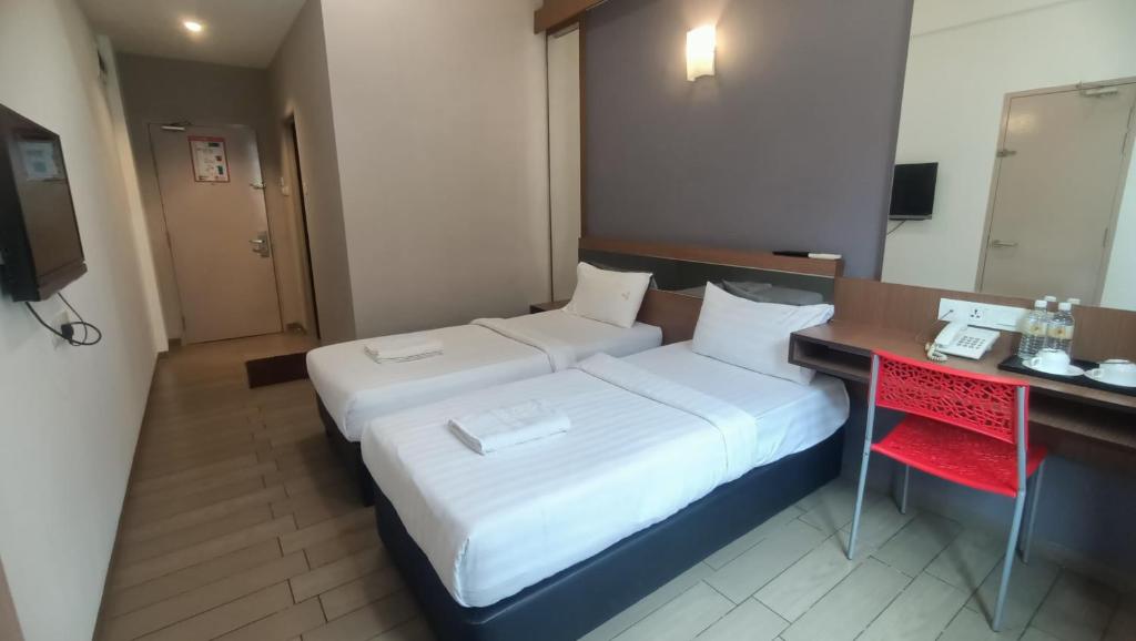 Postel nebo postele na pokoji v ubytování Hotel Golden View Nilai