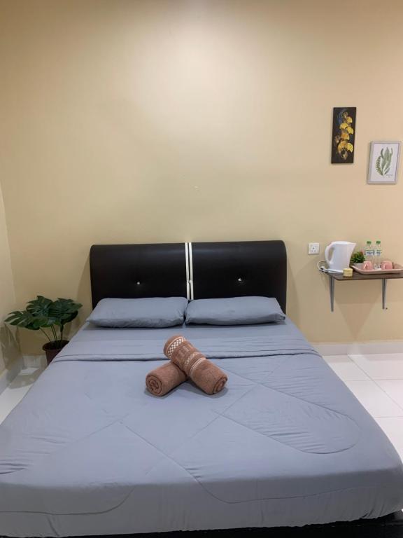 Postel nebo postele na pokoji v ubytování Maze Roomstay Langkawi