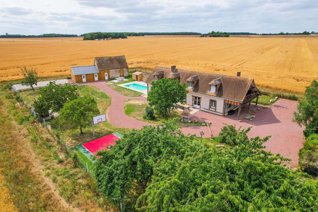 an aerial view of a house in the middle of a field at La Vallee 