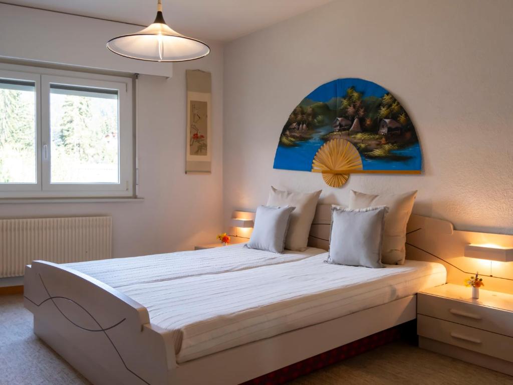 Postel nebo postele na pokoji v ubytování Apartment Les Girolles A59 by Interhome