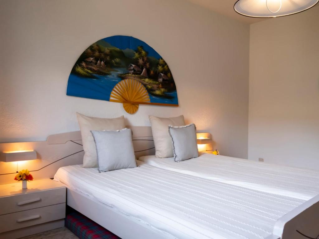 Postel nebo postele na pokoji v ubytování Apartment Les Girolles A59 by Interhome
