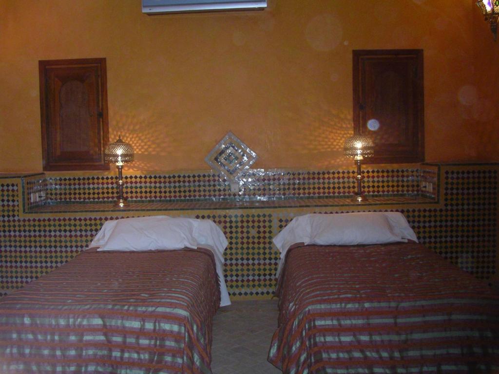Letto o letti in una camera di Hotel Kasbah Azalay