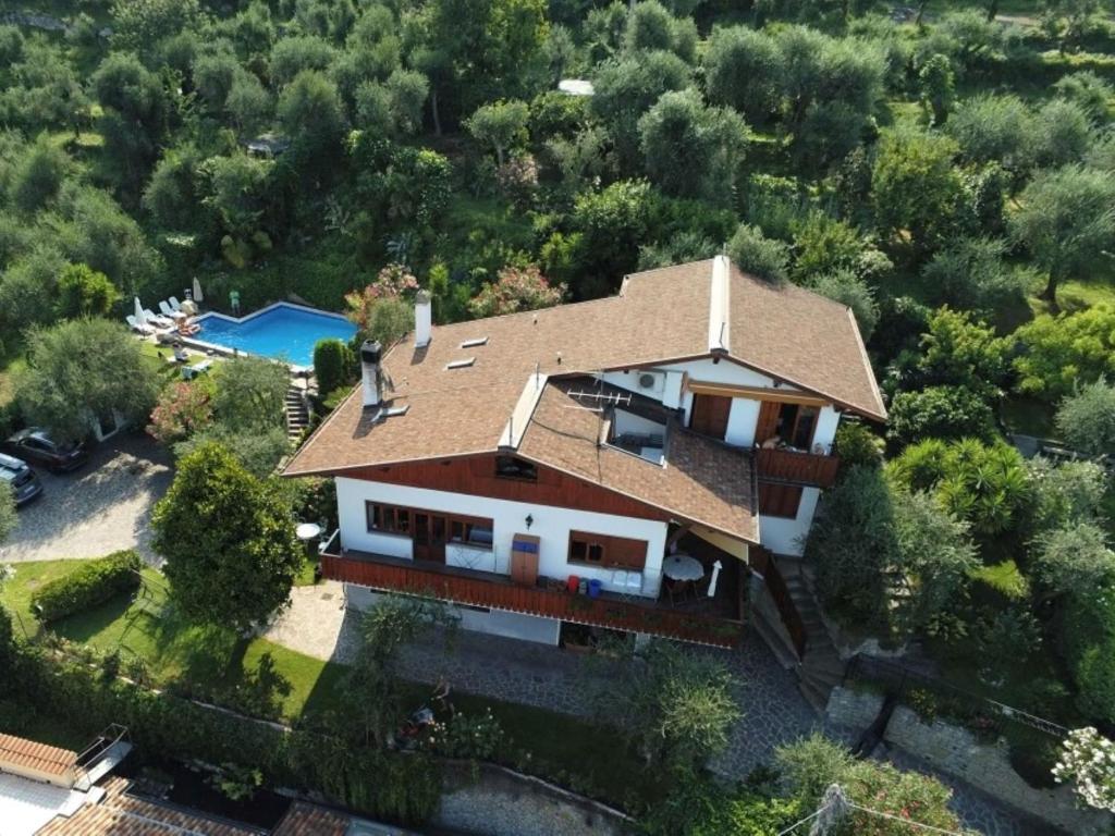 an aerial view of a house with a swimming pool at Apartment Delvai-1 by Interhome in Brenzone sul Garda