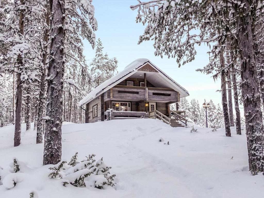 a log cabin in the woods in the snow at Holiday Home Ylikyrön mökki by Interhome in Kyrö