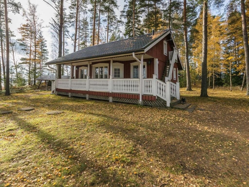 a small house in the middle of a forest at Holiday Home Meritähti by Interhome in Mathildedal