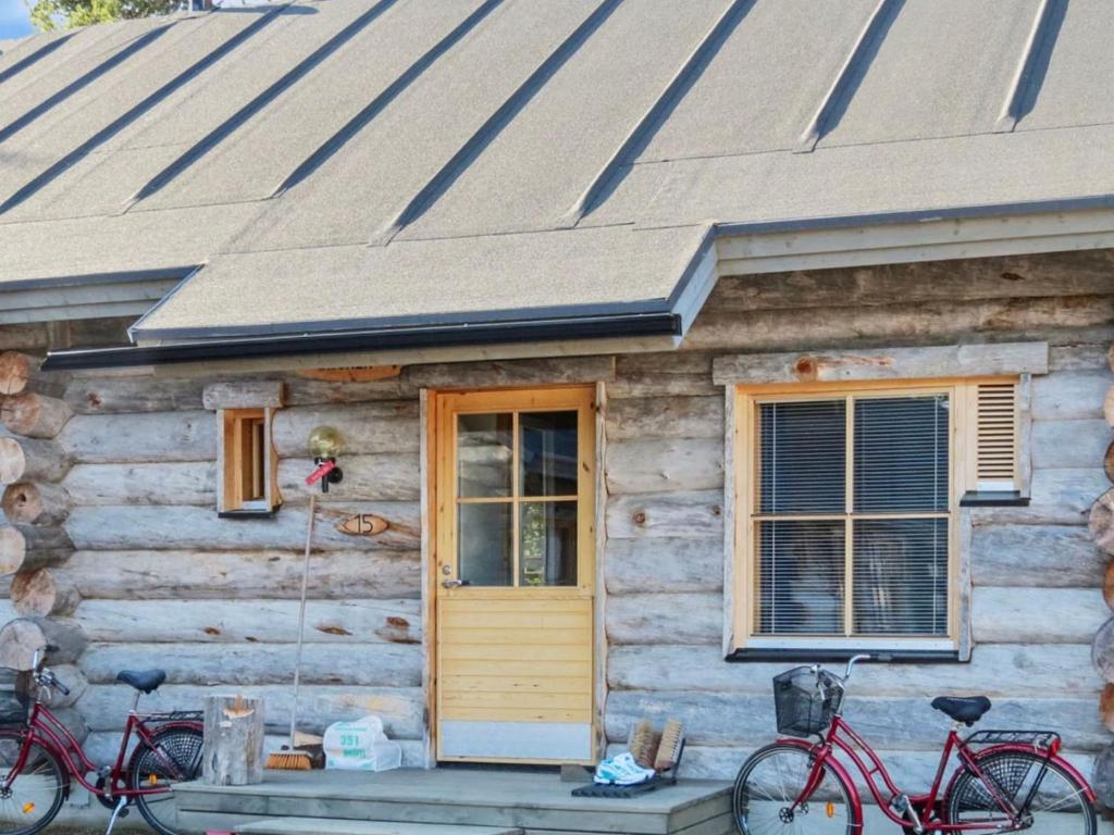 a house with two bikes parked outside of it at Holiday Home Teerentie - fun - dasher by Interhome in Äkäslompolo