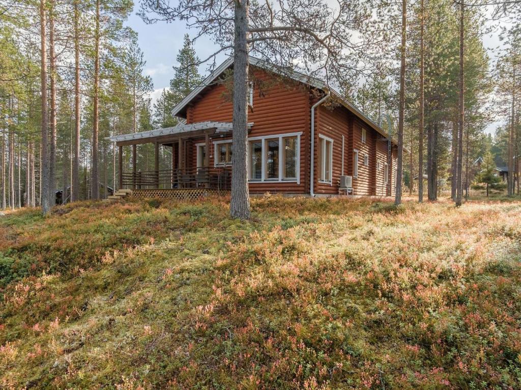a log cabin in the woods on a hill at Holiday Home Kevätruska b by Interhome in Sirkka