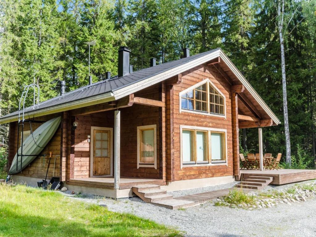 a small wooden cabin with a pitched roof at Holiday Home Marski by Interhome in Kolinkylä