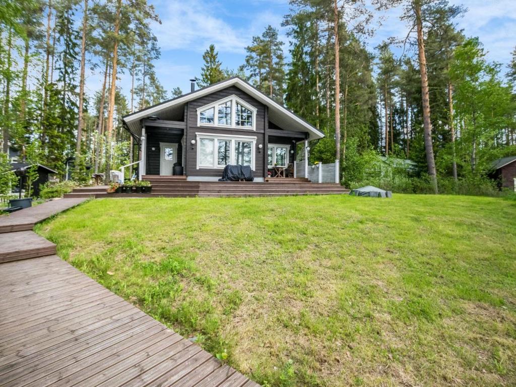a home with a large yard with a house at Holiday Home Villa ina by Interhome in Evijärvi