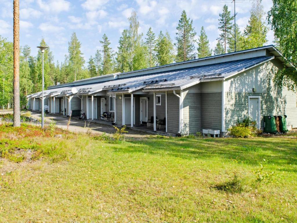 an old house in the woods with a yard at Holiday Home Loma-koli 3 by Interhome in Hattusaari