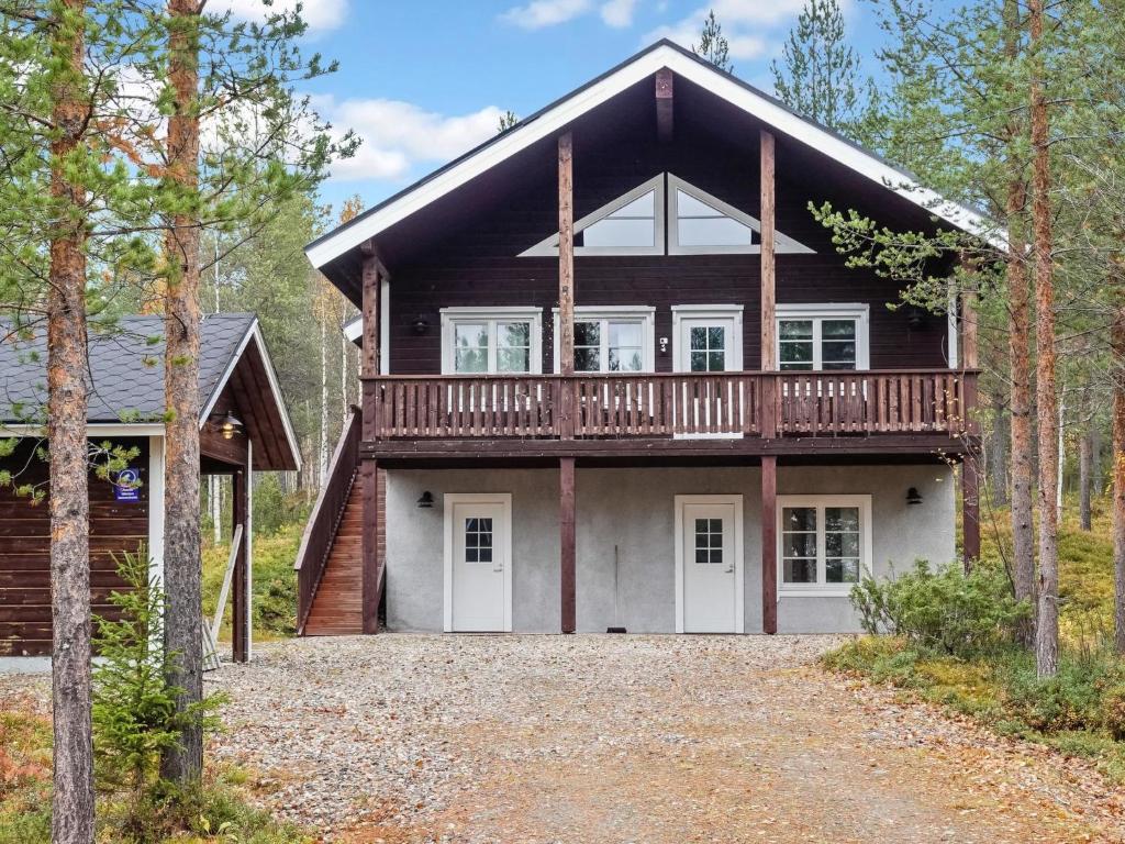 a house with a large deck on the front of it at Holiday Home Lux iii by Interhome in Salla