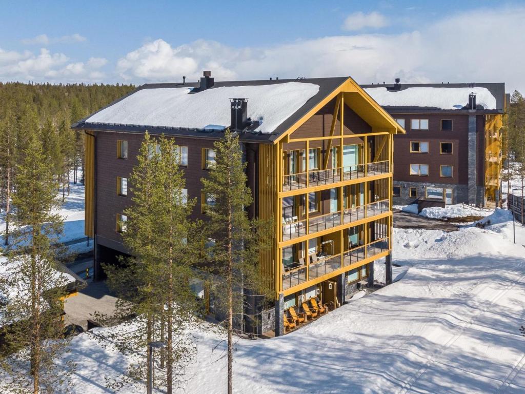 an aerial view of a building in the snow at Holiday Home Tunturinlaita c3 by Interhome in Sirkka