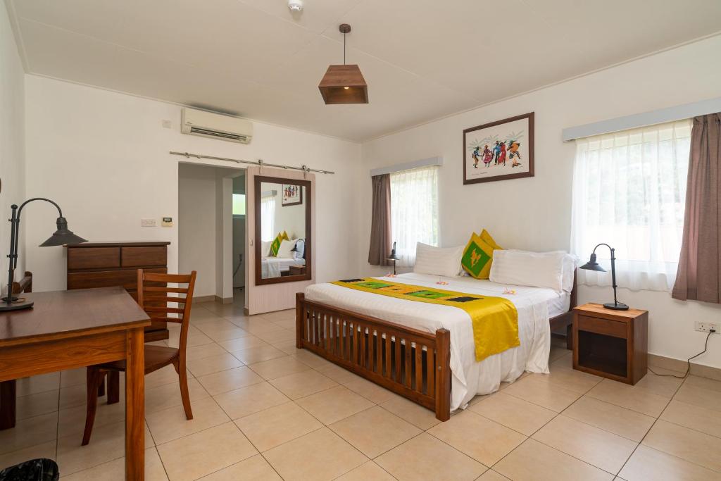 Postel nebo postele na pokoji v ubytování Tropical Hideaway