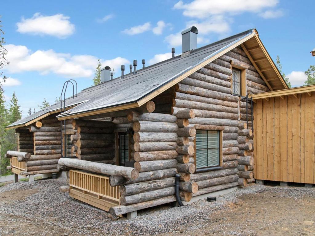 a log cabin with a roof at Holiday Home Taruilevi 10 j2 by Interhome in Sirkka