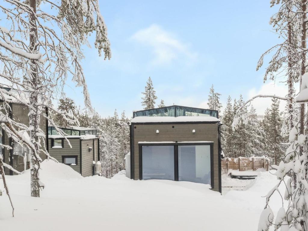 a house in the woods in the snow at Holiday Home Levin loihtu by Interhome in Levi